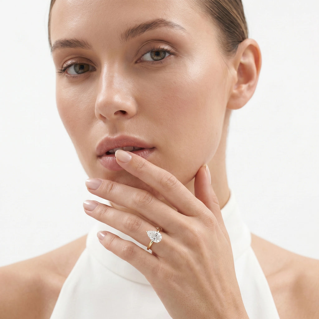 Gold Pear Solitaire Ring