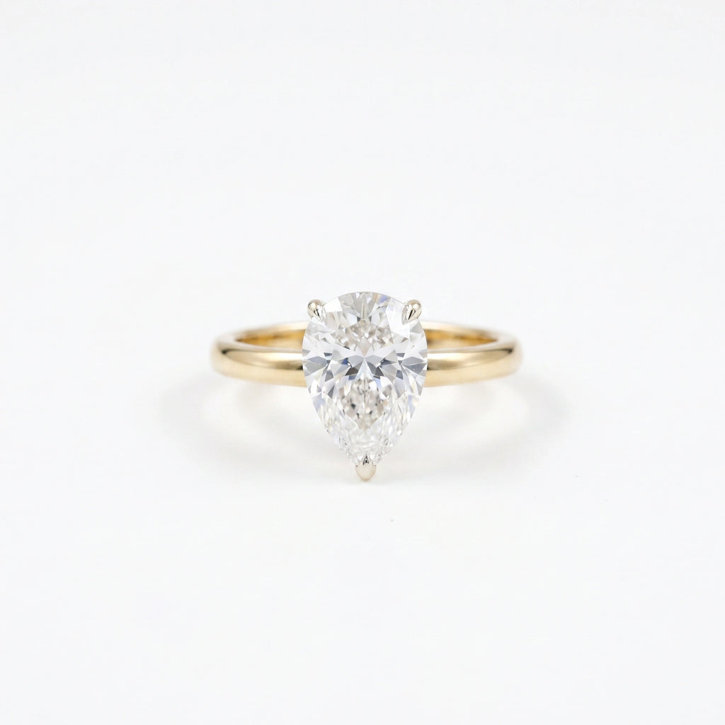 Gold Pear Solitaire Ring