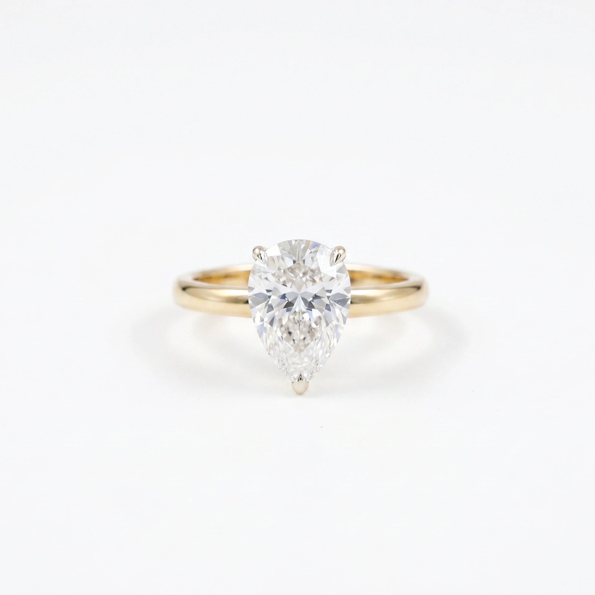 Gold Pear Solitaire Ring